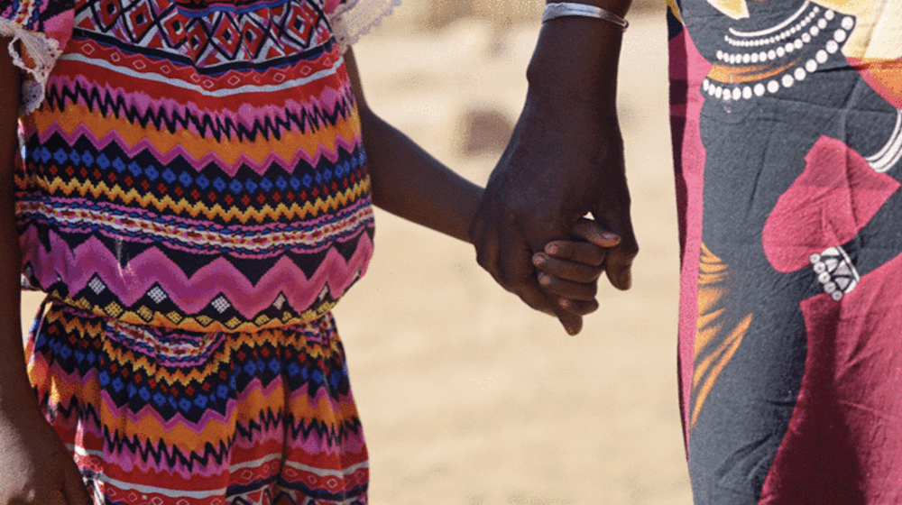 Satiana, 8, holds her grandmother's hand before the trial of her rapist at Ambovombe Court in Madagascar. © UNFPA Madagascar/Mel